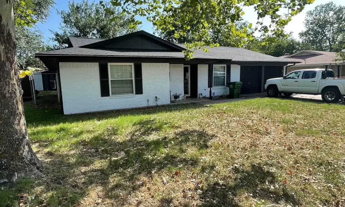 Professional roofing crew working on a residential roof in Mattapoisett